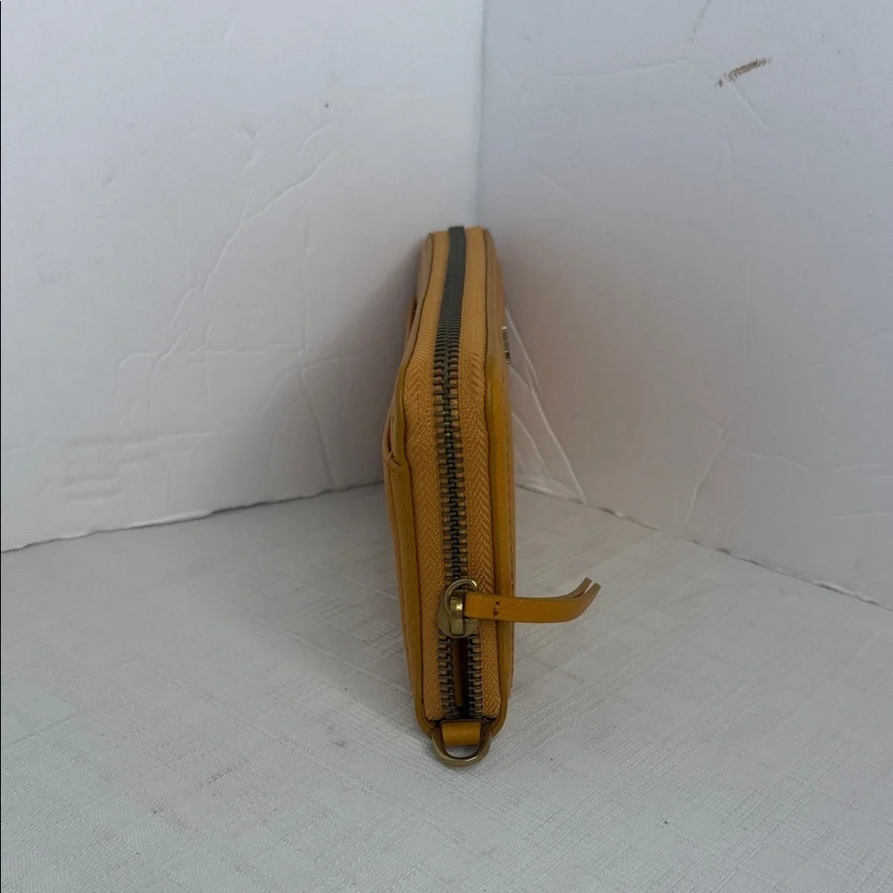 Margot Anna Zip Around Leather Wallet in marigold yellow.